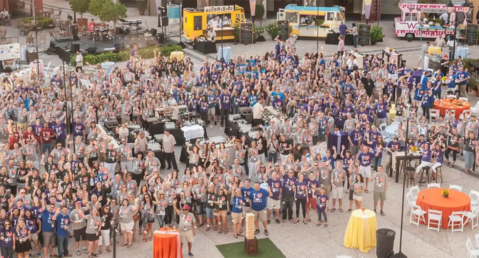 employees from insurance agency gather at employee event